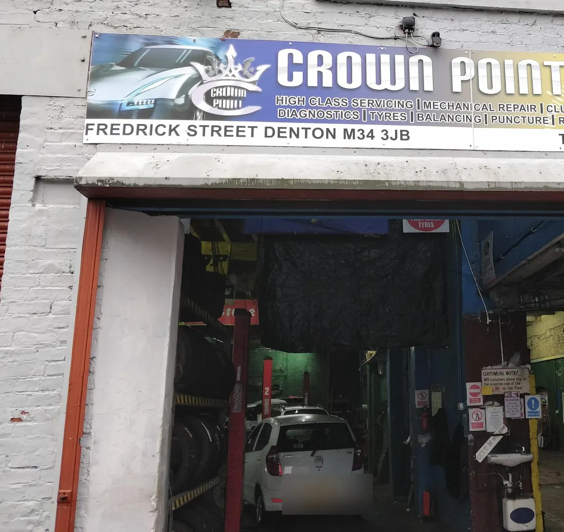 Their doorway on Frederick Street under the CROWN POINT sign